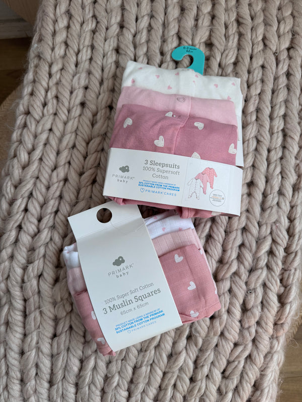 Primark pink sleepsuit