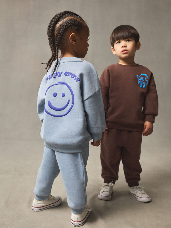 Chocolate Brown and Blue 2 Pack Printed Crew Neck Sweat Top & Jogger Sets (3mths-7yrs)